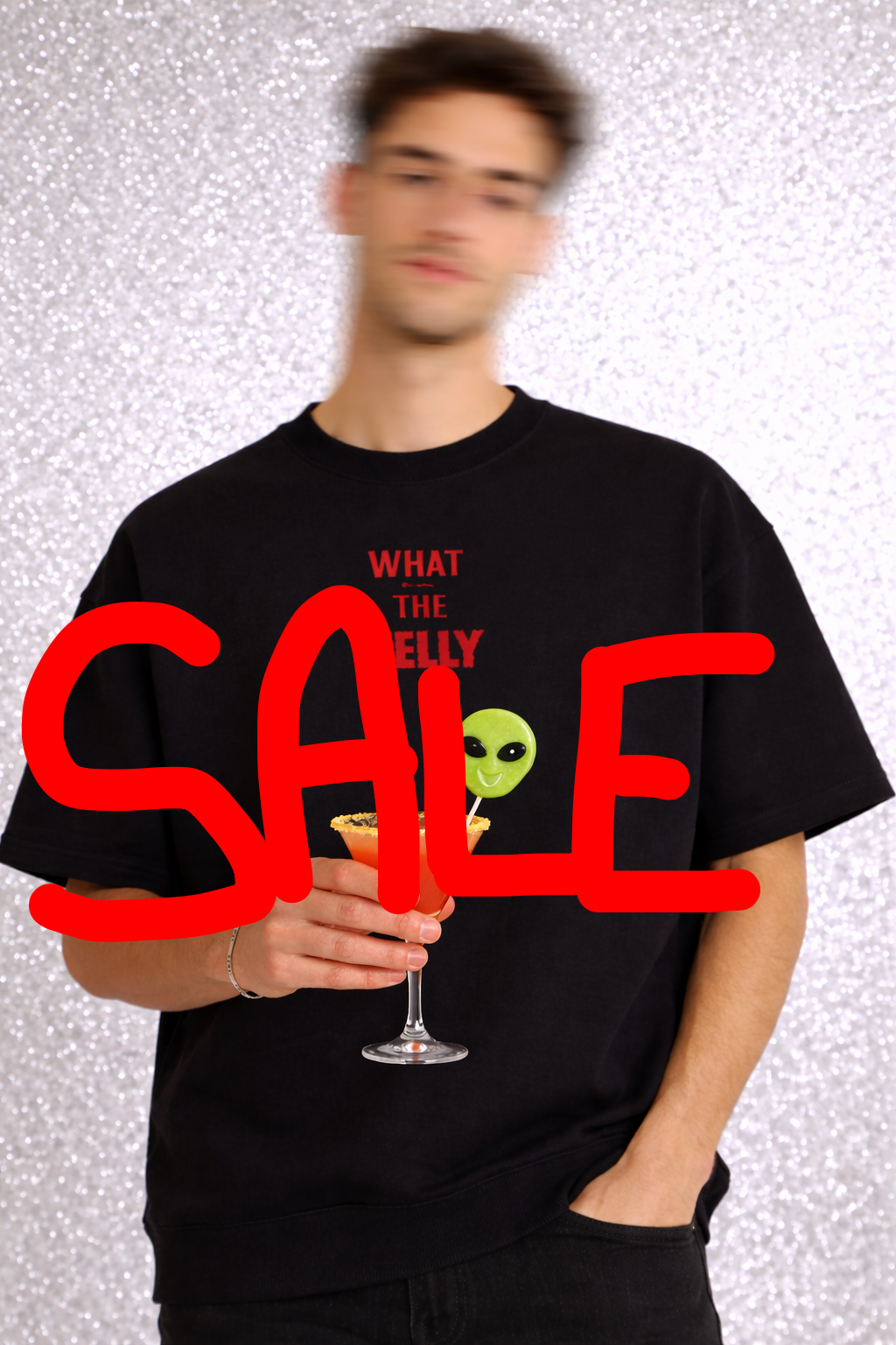 Person wearing a black t-shirt with a graphic design and text, holding a cocktail.